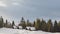 Winter with running clouds over the Carpathian mountains covered with forests and snowdrifts