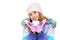 On a winter`s day girl holding in hands snowball in the shape of a heart. Girl standing on a white snow jacket, hat and
