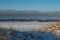 Winter\\\'s Glow: Golden Hour Painting a Snowy Seaside. Garciema Pludmale, Latvija