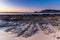 Winter`s Sunrise at Surf Beach with Craggy Rocks