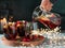 Winter sangria pouring in glasses, christmas table