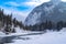 Winter scene of Bow River in Banff National Park with an open river, snow and ice