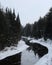 Winter scene featuring the flowing Lake Placid in a forest in the USA