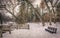 Winter scene at a park in Wisconsin with a vacant park bench