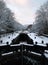 Winter scene on the rochdale canal in hebden bridge with snow covered towpath and houses