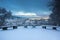 Winter Scene with Snowy Benches in A Storm