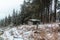 Winter scenery with an abandoned concrete bunker in forest. Velka Destna, Czech republic