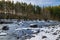 Winter scenery of ice and snow along the White River under Mount Rainier.