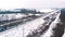 Winter scenery. Train dashing through the snow covered railroad. aerial view