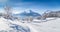 Winter scenery with trees and mountain tops in the Alps