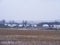 Winter scenic photo of old slavic willage with wooden traditional russian houses