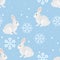 Winter seamless pattern. Cute hares and beautiful snowflakes on  blue background.