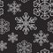 Winter seamless pattern with white snowflakes on black background. Endless snow ornament for banner, card, paper