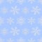 Winter seamless pattern with white snowflakes on light blue back