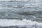 Winter seascape background splashing water waves