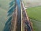 Winter Serenity: Aerial View of River or Canal Amidst Frozen Farm Fields