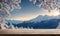 Winter serenity: Empty wooden table with snowy mountain backdrop