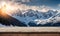 Winter serenity: Empty wooden table with snowy mountain backdrop