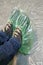On winter shoes with laces, cellophane green shoe covers.