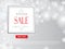 Winter shopping sale banner with lettering. Snow blurred background. Holiday sale with snowflakes over grey background