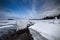 Winter shore of White Sea under the wonderful sky.