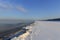 Winter shoreline of baltic sea with snow and ice