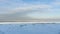 Winter shoreline of baltic sea with snow and ice under blue sky with clouds, selective focus