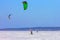 Winter skating of an athlete on kiting under a dome on a snow-covered lake.