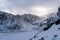 Winter and Snow at Black Pond or Czarny Staw at Rysy Peak in Poland. Panoramic winter landscape with frozen lake