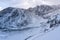 Winter and Snow at Black Pond or Czarny Staw at Rysy Peak in Poland. Panoramic winter landscape with frozen lake