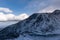 Winter and Snow at Black Pond or Czarny Staw at Rysy Peak in Poland. Panoramic winter landscape with frozen lake