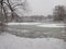 Winter snow-capped mere in forest