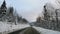 winter snow-covered road in a mountain forest. shooting through the windshield.