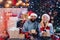 Winter snow decorating. Portrait of a young beautiful smiling couple. Christmas couple. winter freands wearing red santa