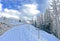 Winter snow idyll along the rural alpine road above the tourist resort of Lenzerheide