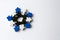 winter snowflake made of meeples - components of strategy board game on white background with copyspace