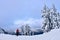 Winter snowshoe hiking in mountains.