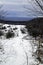 Winter snowy hiking trail in mountains