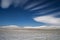 Winter snowy landscape with lenticular clouds