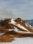 Winter Snowy Mountain. Mountainside Covered by Orange Grass and Snow.