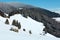 Winter snowy mountains, and lone farmhouse