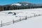 Winter snowy mountains, and lone farmhouse