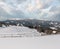 Winter snowy mountains, and lone farmstead