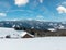 Winter snowy mountains, and lone farmstead