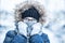 Winter snowy portrait of young girl in warm clothing