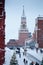 Winter Spasskaya Tower with big chime, Christmas tree and people at Moscow Red Square after great snowfall