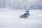 Winter Speedway. Racers unmarked drive on the ice road