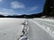 A winter sport cross-country ski trail around a frozen alpine Heidsee lake (Igl Lai lake) in the resort of Lenzerheide