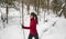 Winter sport. Cross Country skiing Classic Style Nordic Skiing in Forest. Woman in winter doing fun winter sport