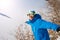 Winter sport. A man snowboarder in the goggles having fun playin